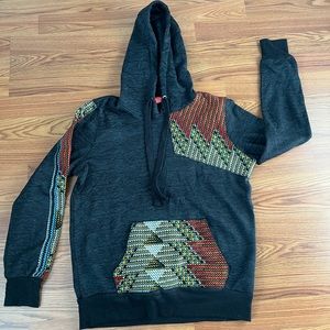 Sweatshirt accented with African cloth.